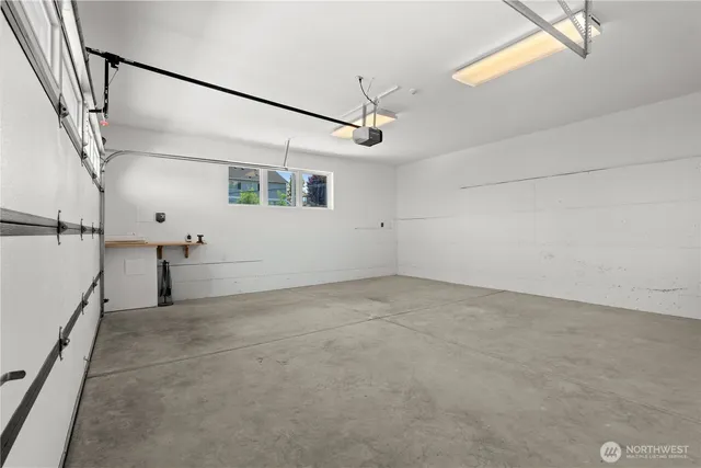 an aerial view of a house with garden space and outdoor seating