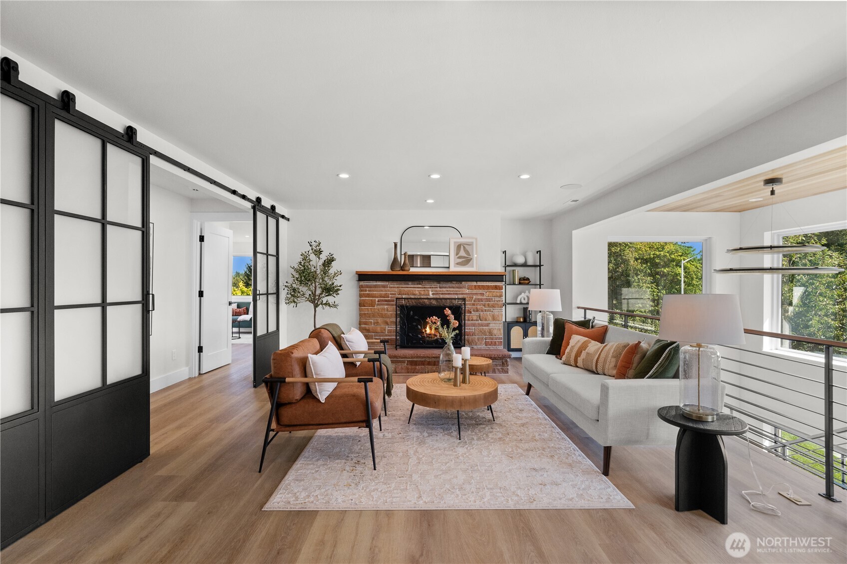 12208 Southeast 192nd Street Renton, WA 98058 - Photo 7 of 40 a living room with furniture and a fireplace