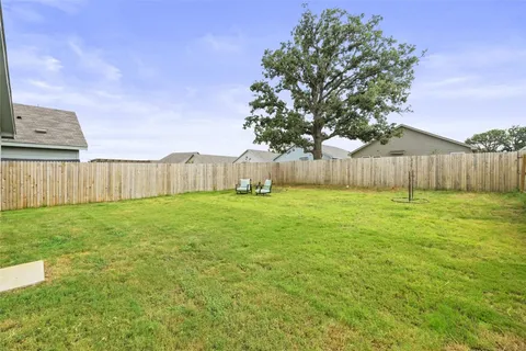 a swimming pool with wooden fence