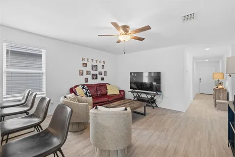 a work room with furniture and wooden floor