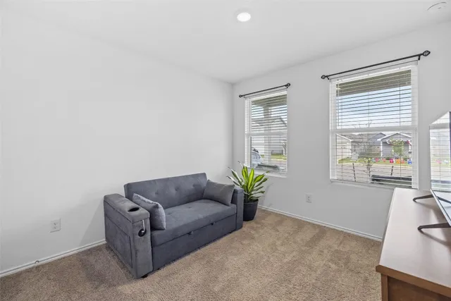 a living room with furniture and window