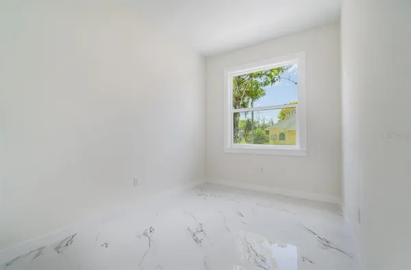 an empty room with windows