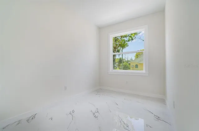 an empty room with windows