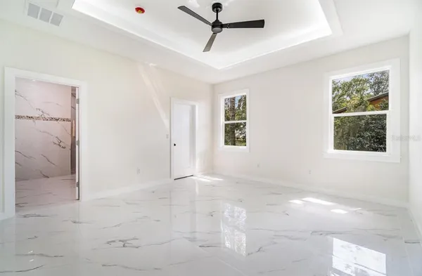 a view of an empty room with a window