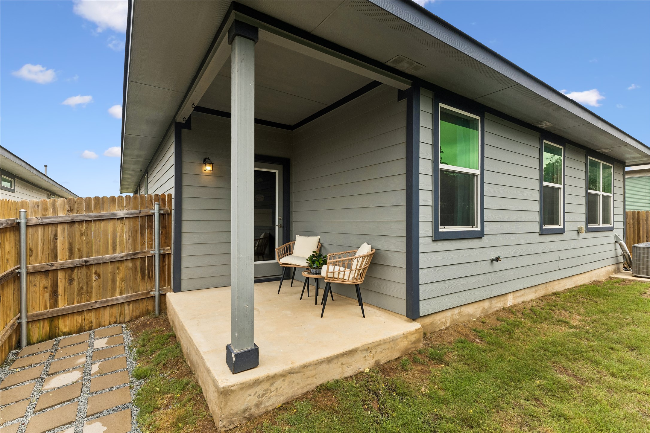 249 Century Plant Road Leander, TX 78641 - Photo 17 of 22 a view of a patio with table and chairs and wooden floor
