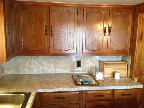 619 Tower Street Fall River, MA 02721 - Photo 25 of 29 a kitchen with granite countertop a sink and cabinets