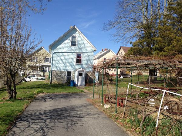 619 Tower Street Fall River, MA 02721 - Photo 5 of 29 a view of a house with a yard