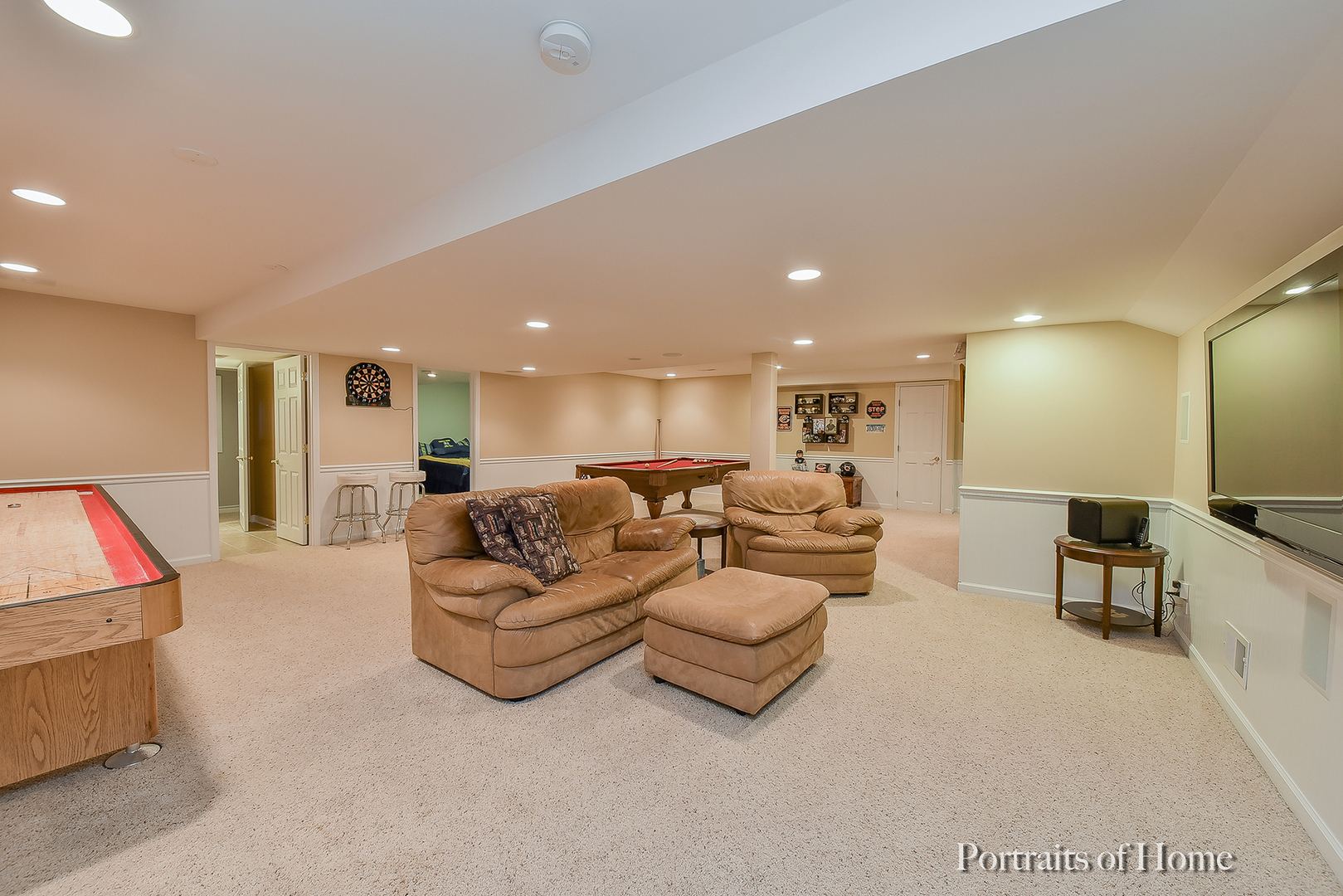 2731 Wendy Road Naperville, IL 60565 - Photo 22 of 31 a living room with furniture and a flat screen tv