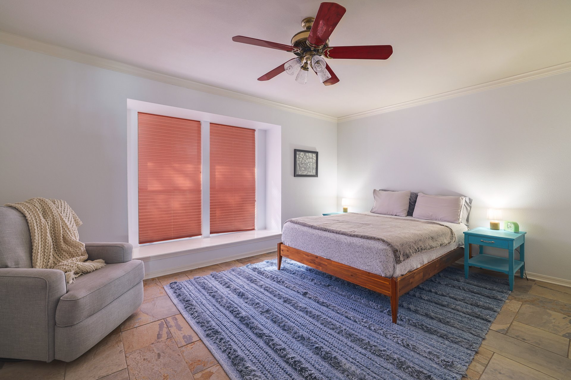 5500 Cedro Trail Austin, TX 78731 - Photo 25 of 34 Bedroom featuring crown molding, a ceiling fan, and stone tile flooring