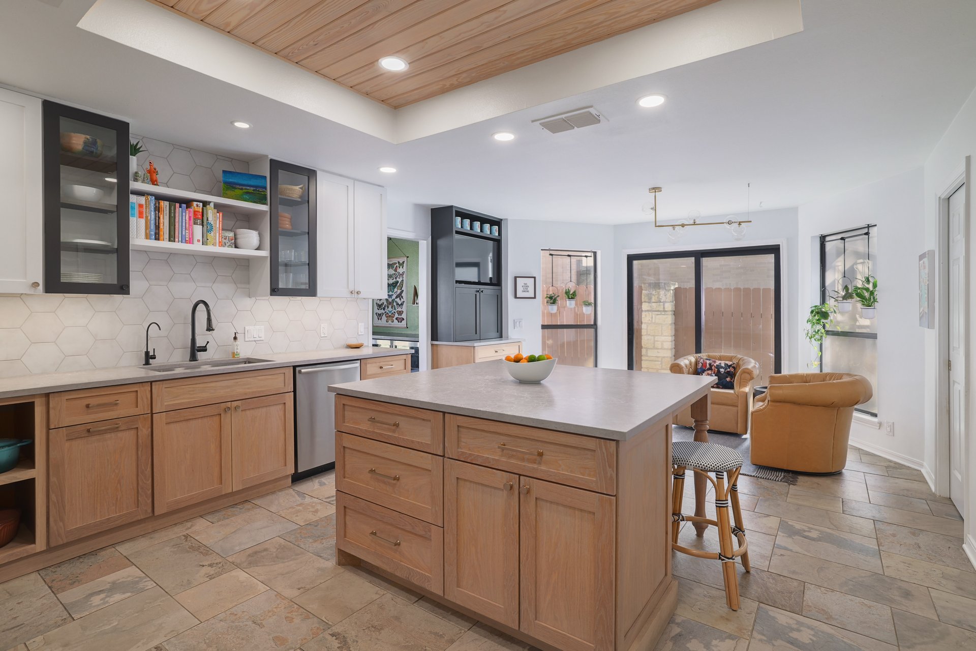 5500 Cedro Trail Austin, TX 78731 - Photo 10 of 34 Kitchen featuring open shelves, glass fronted cabinets, stone tile floors, light countertops, and a wood tray ceiling