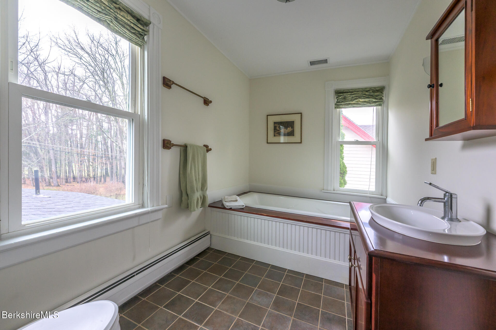 11 Sergeant Street Stockbridge, MA 01262 - Photo 31 of 52 a bathroom with a bathtub sink and mirror