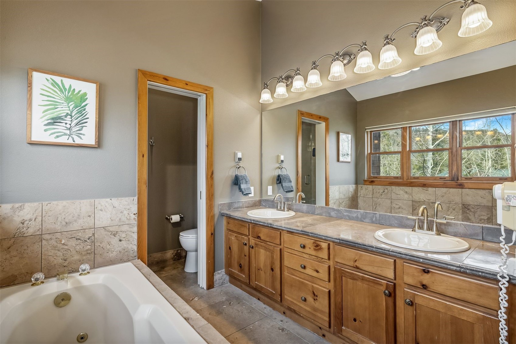 71 Starfire Lane, Unit 1978 Keystone, CO 80435 - Photo 19 of 40 a spacious bathroom with a double vanity sink mirror and double