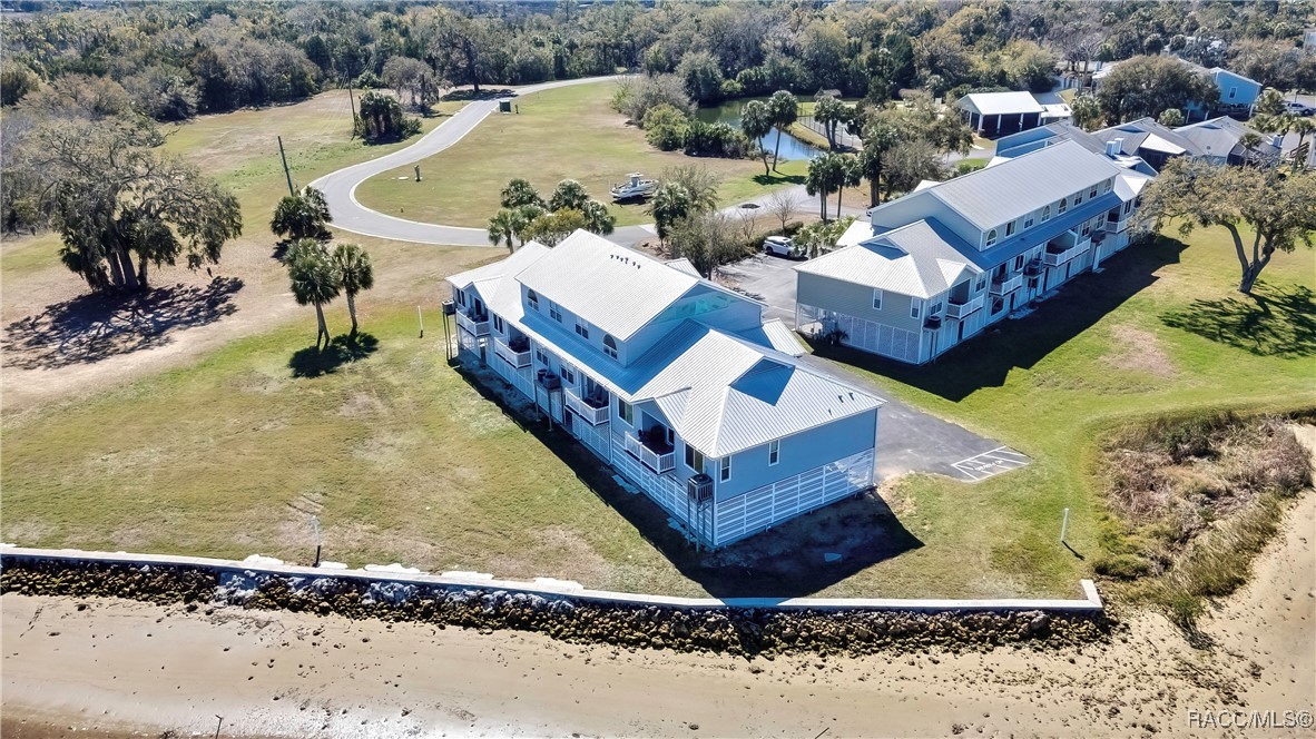 2855 North Rivers Edge Boulevard, Unit 213 Crystal River, FL 34429 - Photo 52 of 62 a view of a house with a yard