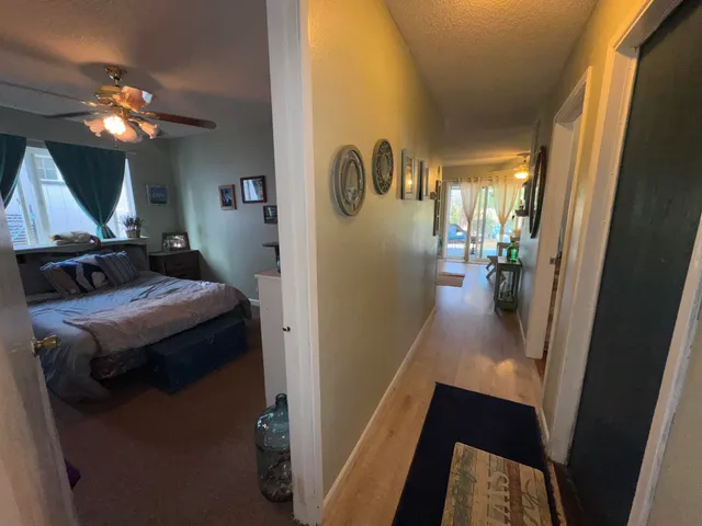 a backyard of a house with table and chairs
