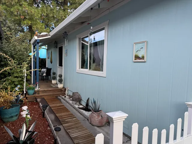 a view of two chairs in the balcony