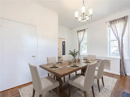 a view of a dining room with furniture and window