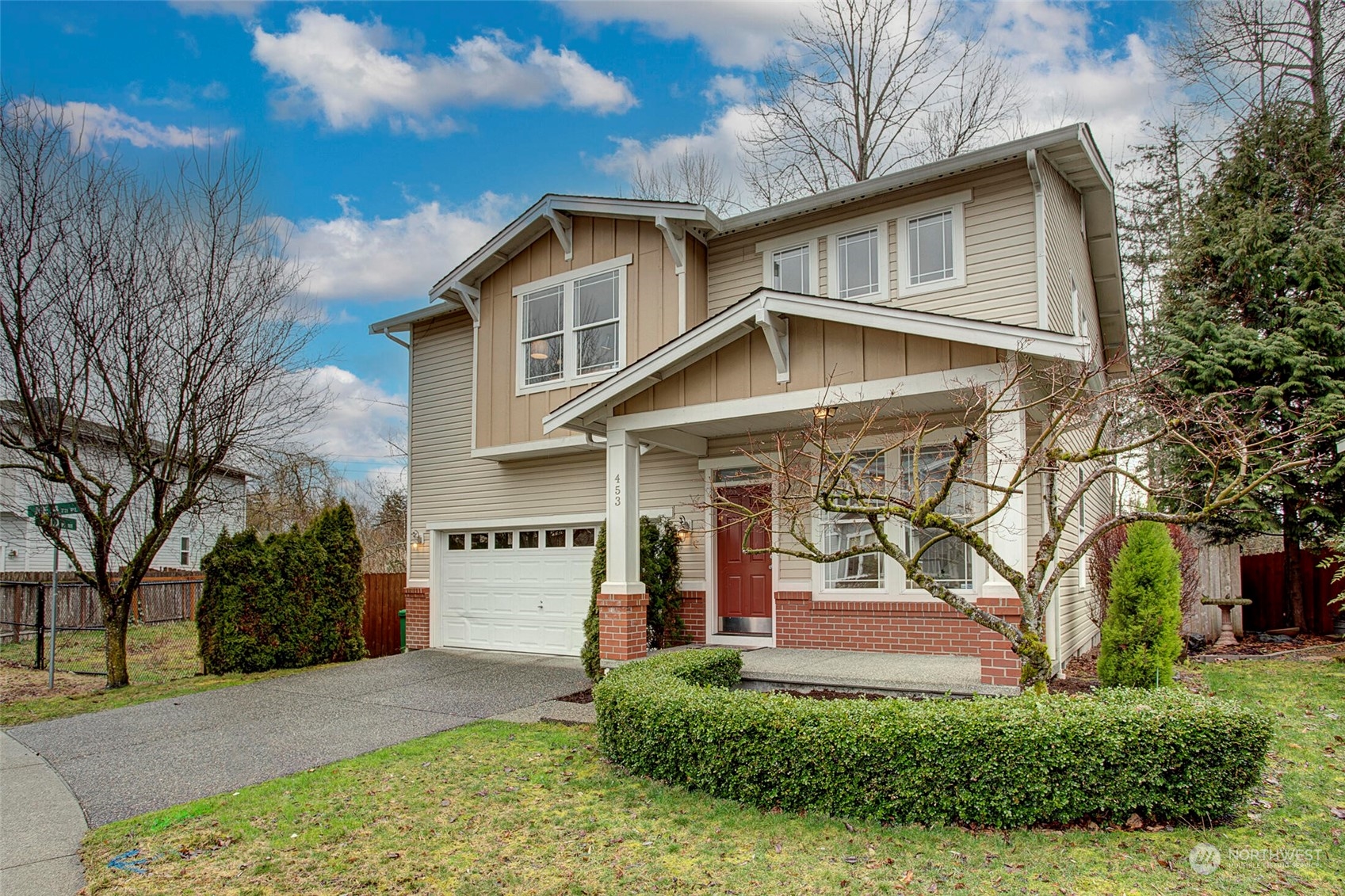 453 Field Place Northeast Renton, WA 98059 - Photo 1 of 36 a front view of a house with a yard and garage