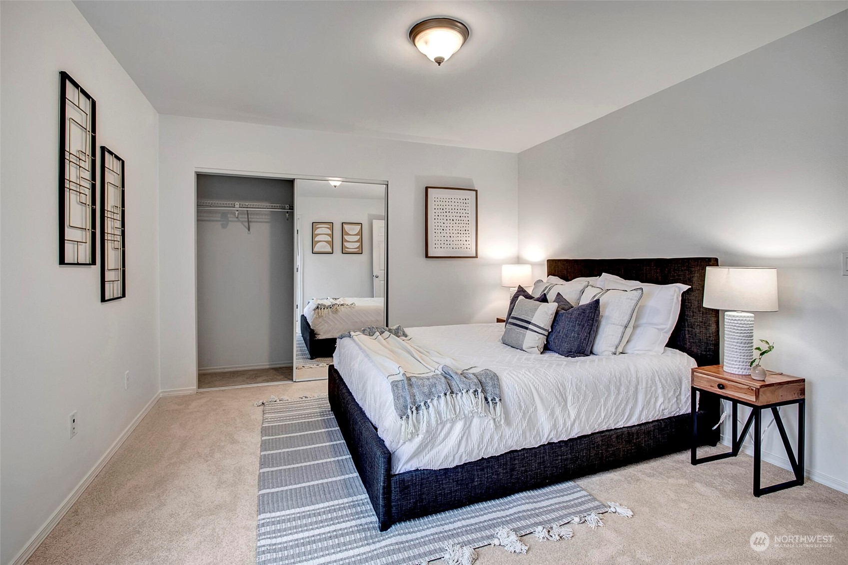 453 Field Place Northeast Renton, WA 98059 - Photo 21 of 36 a bedroom with a bed and a night stand
