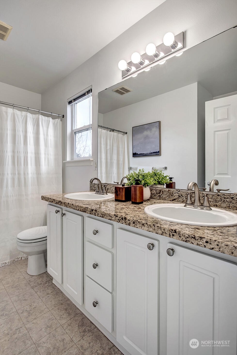 453 Field Place Northeast Renton, WA 98059 - Photo 24 of 36 a bathroom with a granite countertop sink and a mirror