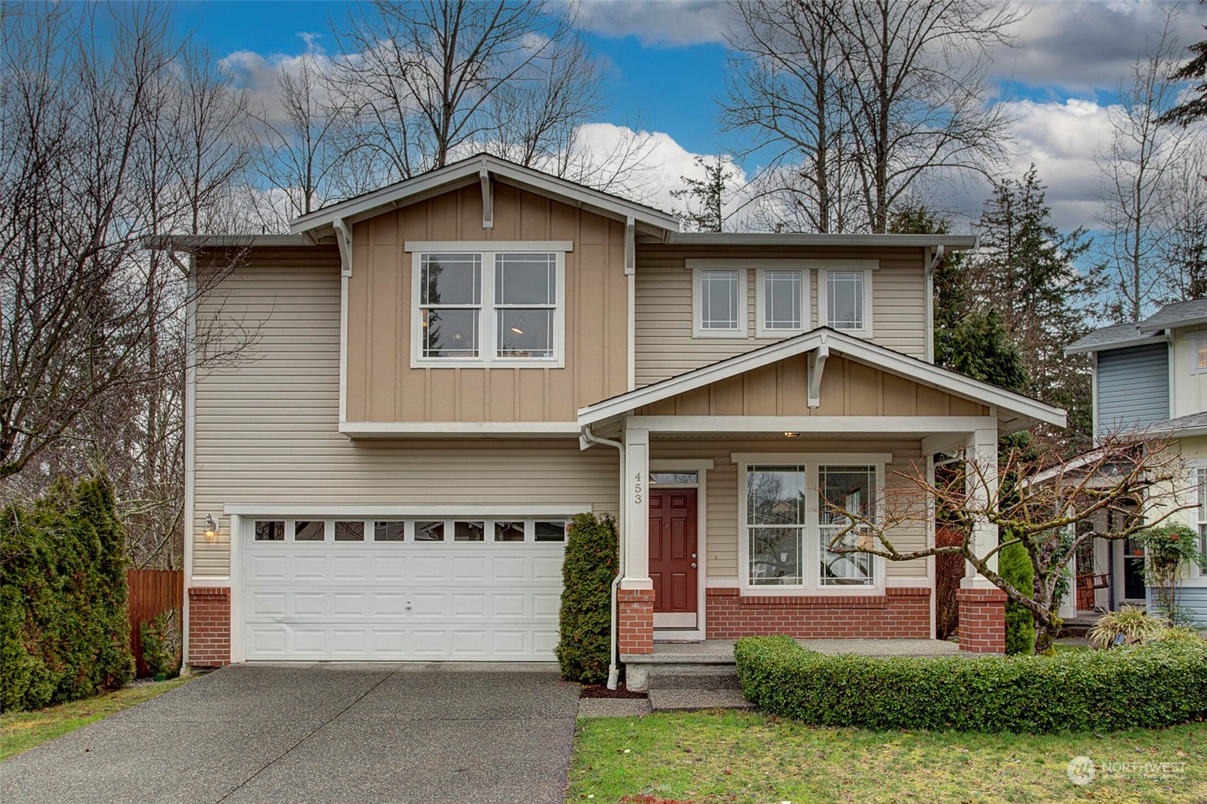 453 Field Place Northeast Renton, WA 98059 - Photo 26 of 36 a front view of a house with a yard