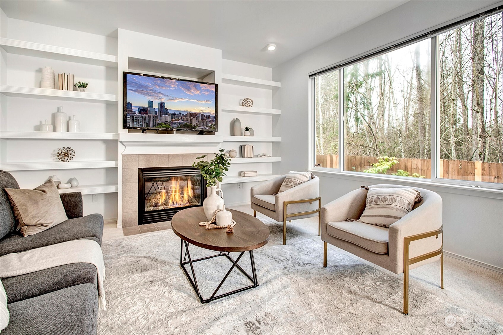 453 Field Place Northeast Renton, WA 98059 - Photo 4 of 36 a living room with furniture fireplace and a large window