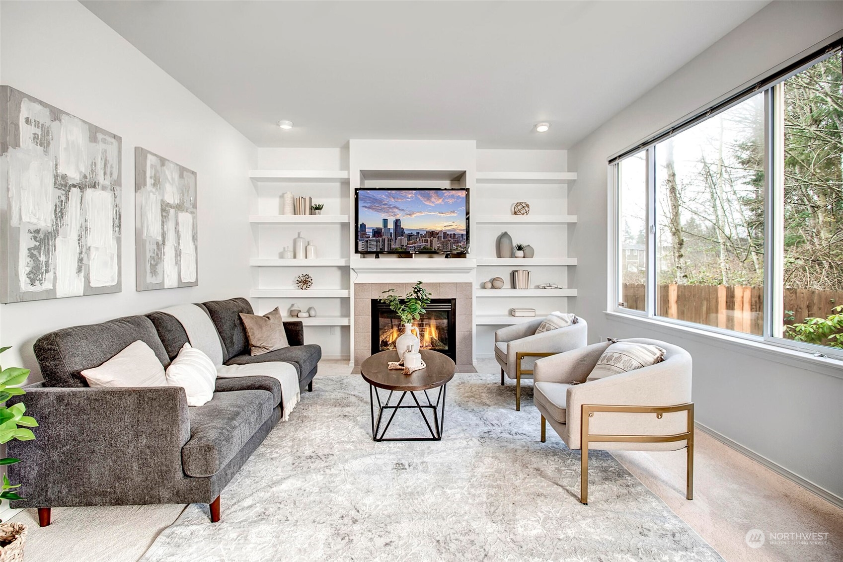 453 Field Place Northeast Renton, WA 98059 - Photo 7 of 36 a living room with furniture a fireplace and a large window