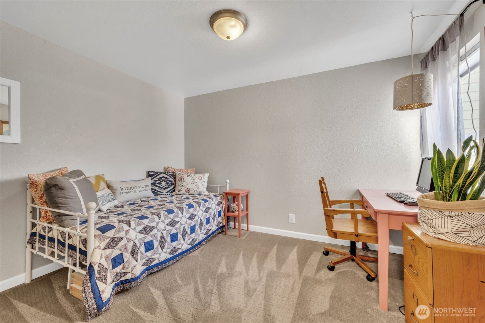 4231 Northeast 5th Street, Unit E101 Renton, WA 98059 - Photo 17 of 29 a bedroom with a bed and a desk