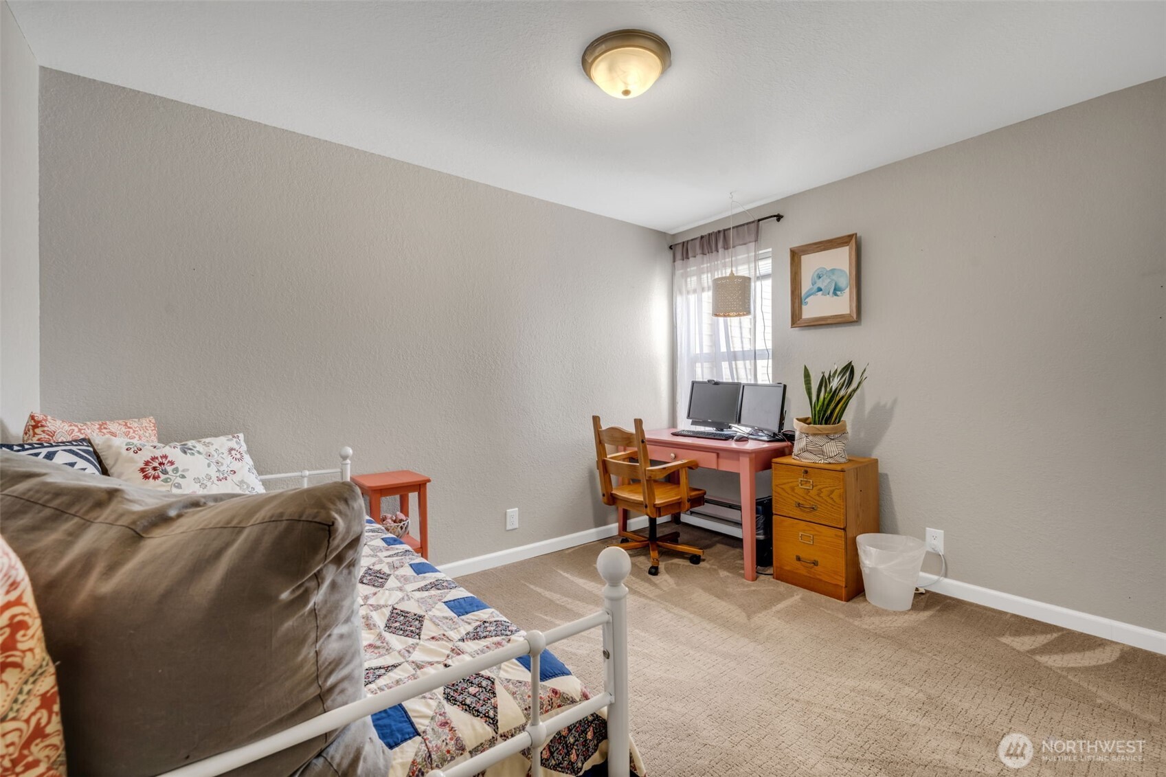 4231 Northeast 5th Street, Unit E101 Renton, WA 98059 - Photo 18 of 29 a bedroom with bed and a window