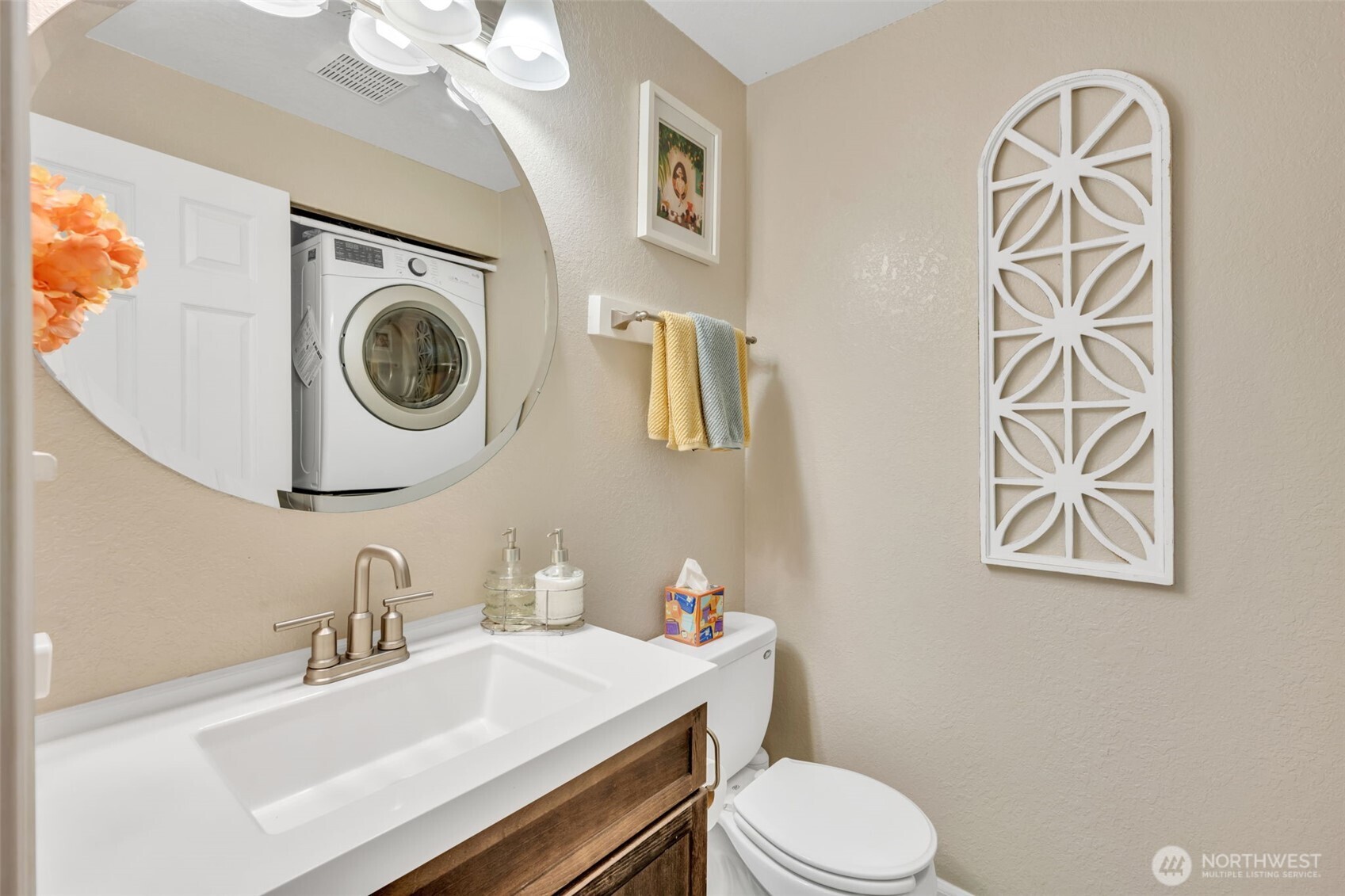 4231 Northeast 5th Street, Unit E101 Renton, WA 98059 - Photo 22 of 29 a bathroom with a sink a toilet and a mirror