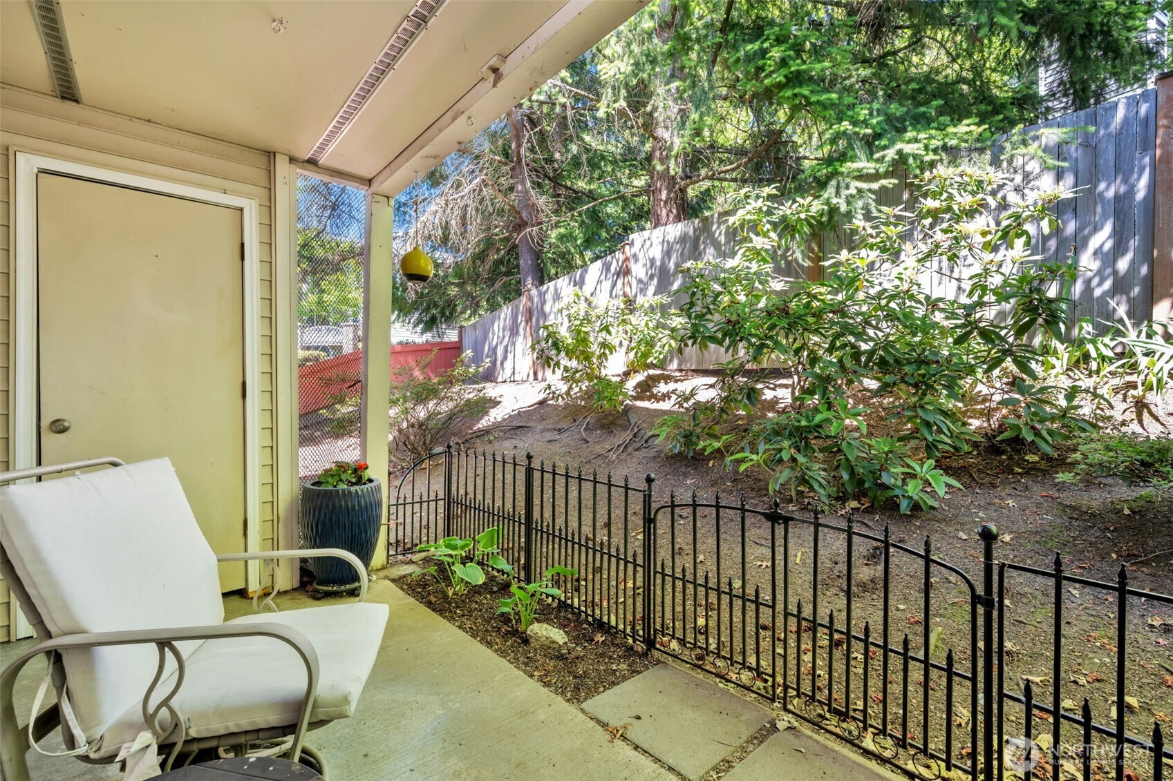 4231 Northeast 5th Street, Unit E101 Renton, WA 98059 - Photo 24 of 29 a view of a chair and table in the balcony