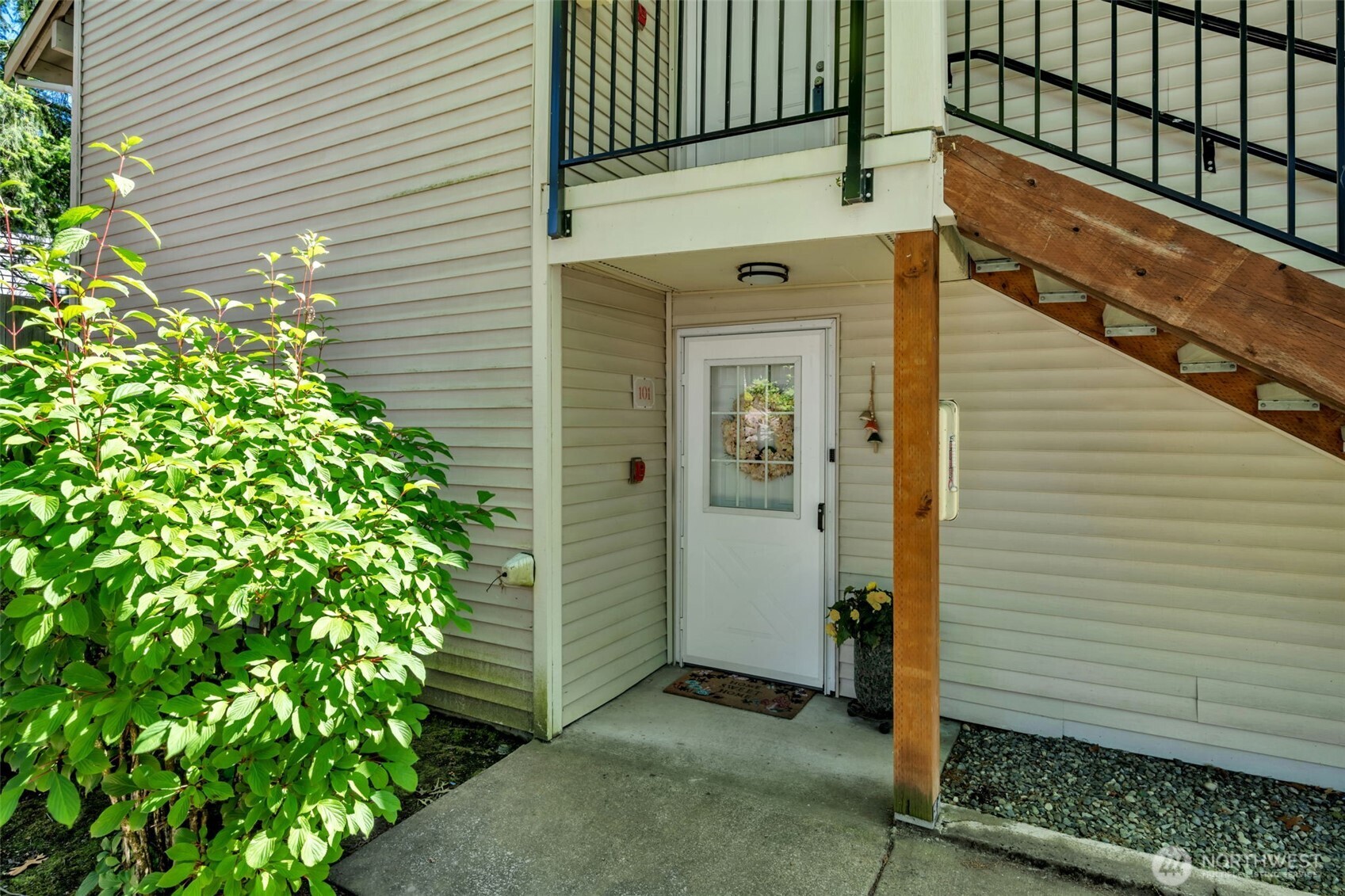 4231 Northeast 5th Street, Unit E101 Renton, WA 98059 - Photo 26 of 29 a view of small house with potted plants