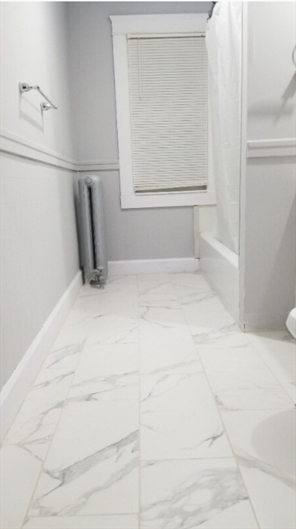 191 Eastern Avenue, Unit 2 Worcester, MA 01605 - Photo 5 of 6 a view of an empty room with a window