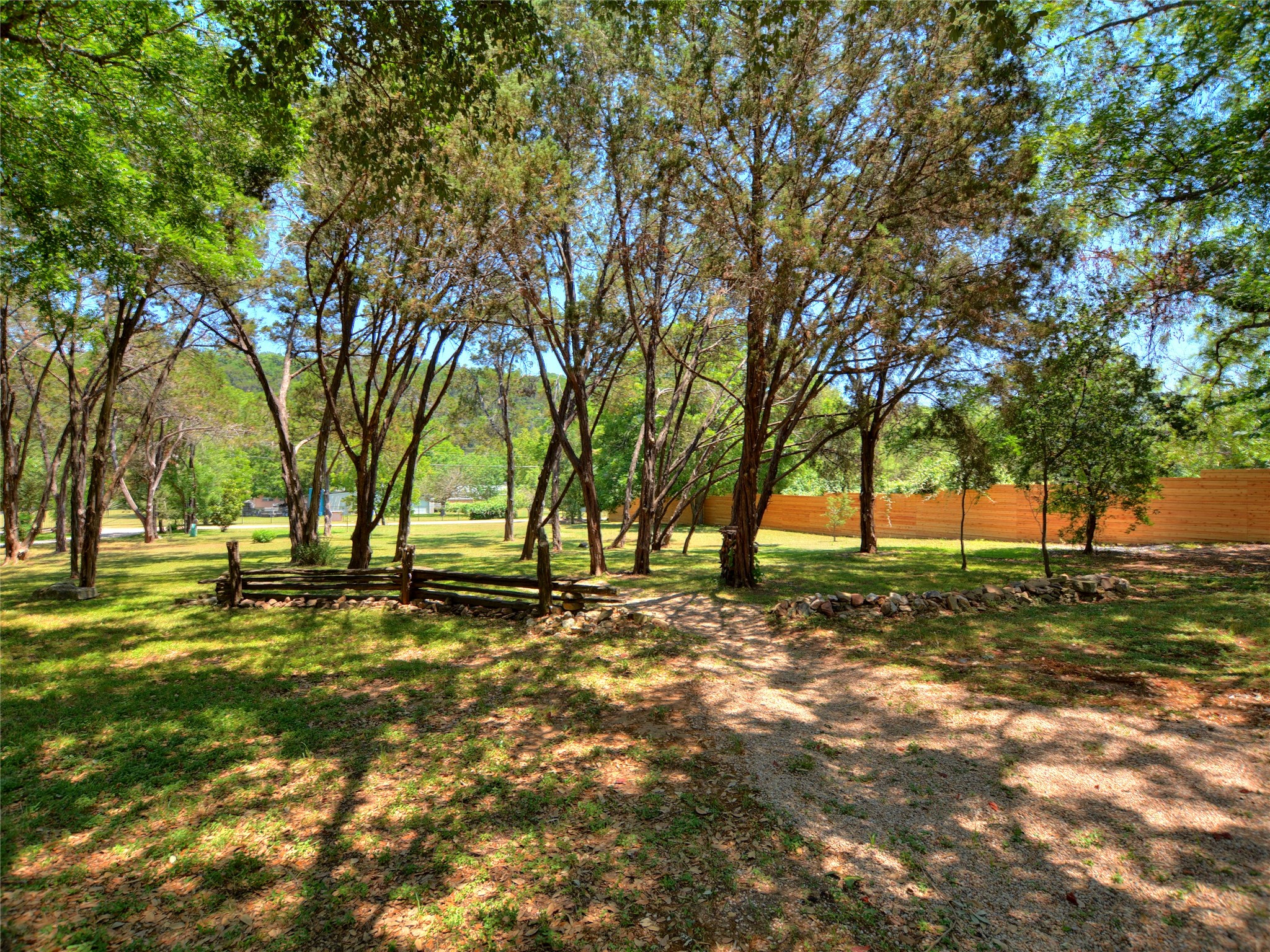 302 Lago Verde Road Lakeway, TX 78734 - Photo 21 of 21 View of yard in summer