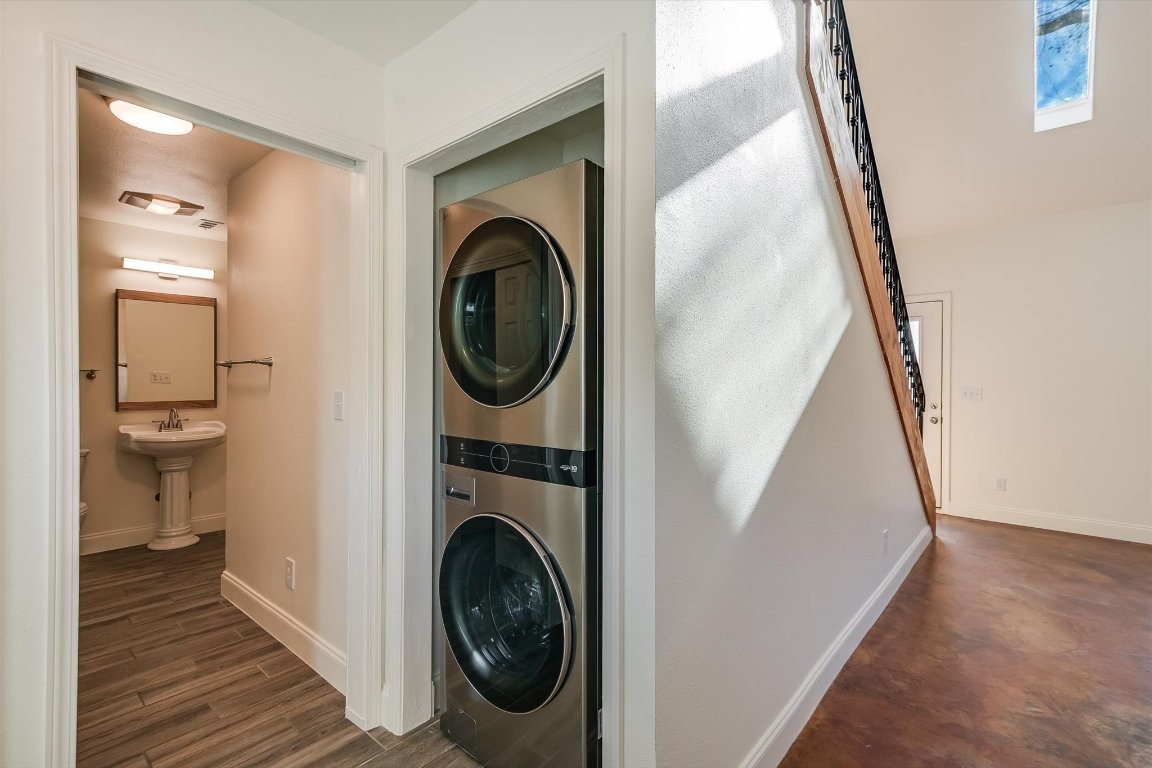 302 Lago Verde Road Lakeway, TX 78734 - Photo 9 of 21 Laundry area with baseboards and stacked washer / dryer