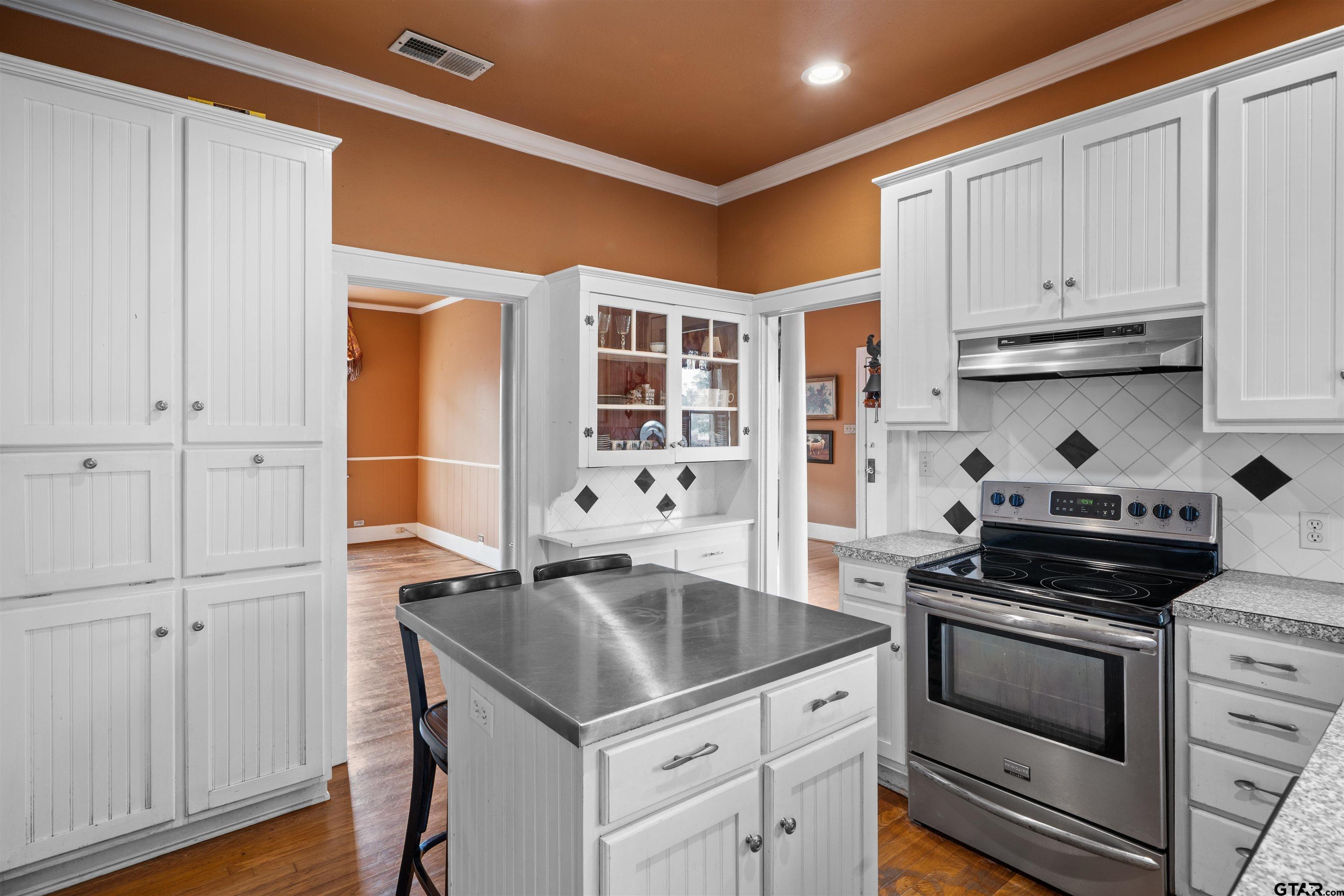 315 Mockingbird Lane Tyler, TX 75701 - Photo 13 of 33 a kitchen with stainless steel appliances granite countertop a sink and cabinets