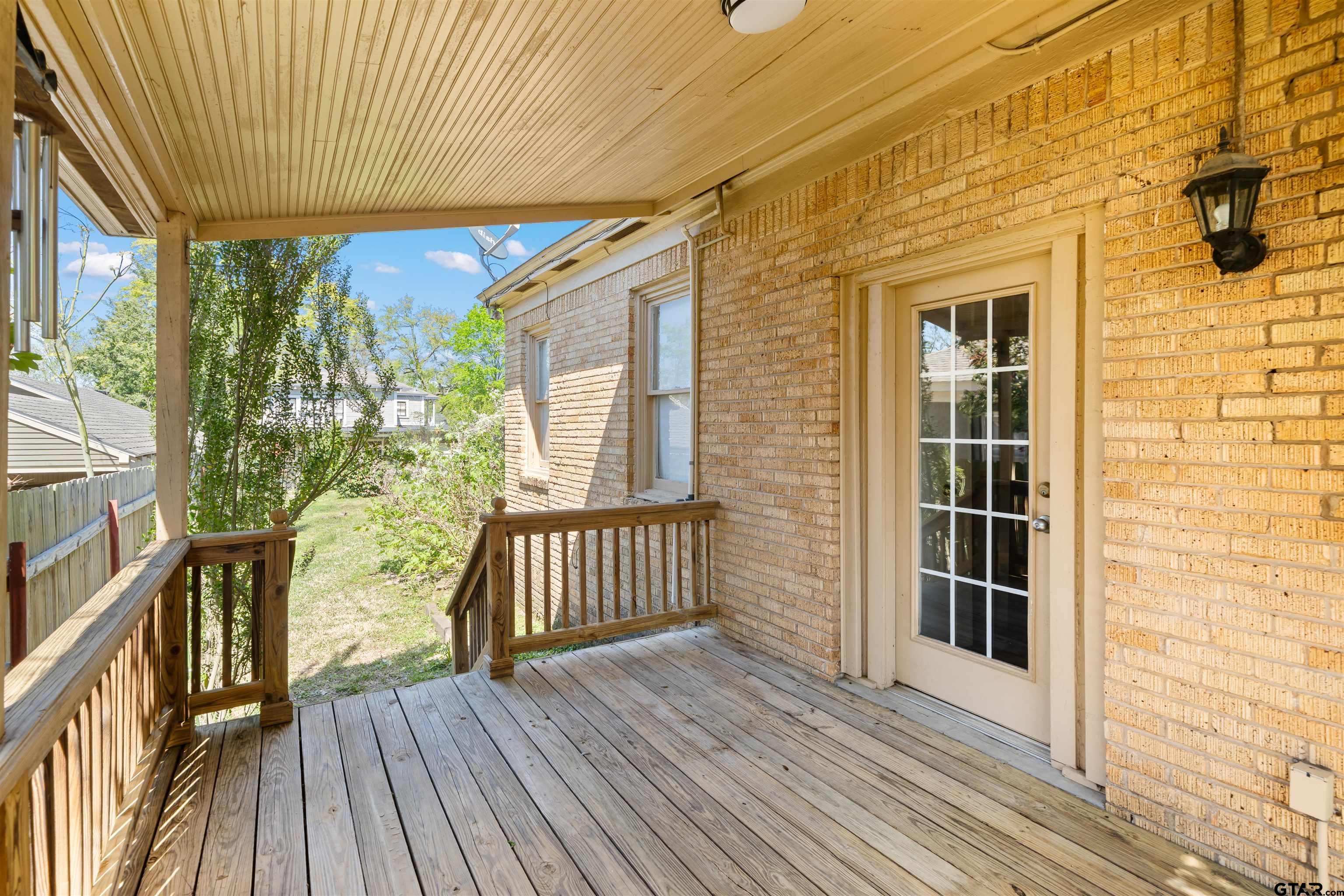 315 Mockingbird Lane Tyler, TX 75701 - Photo 16 of 33 a view of a balcony with wooden floor