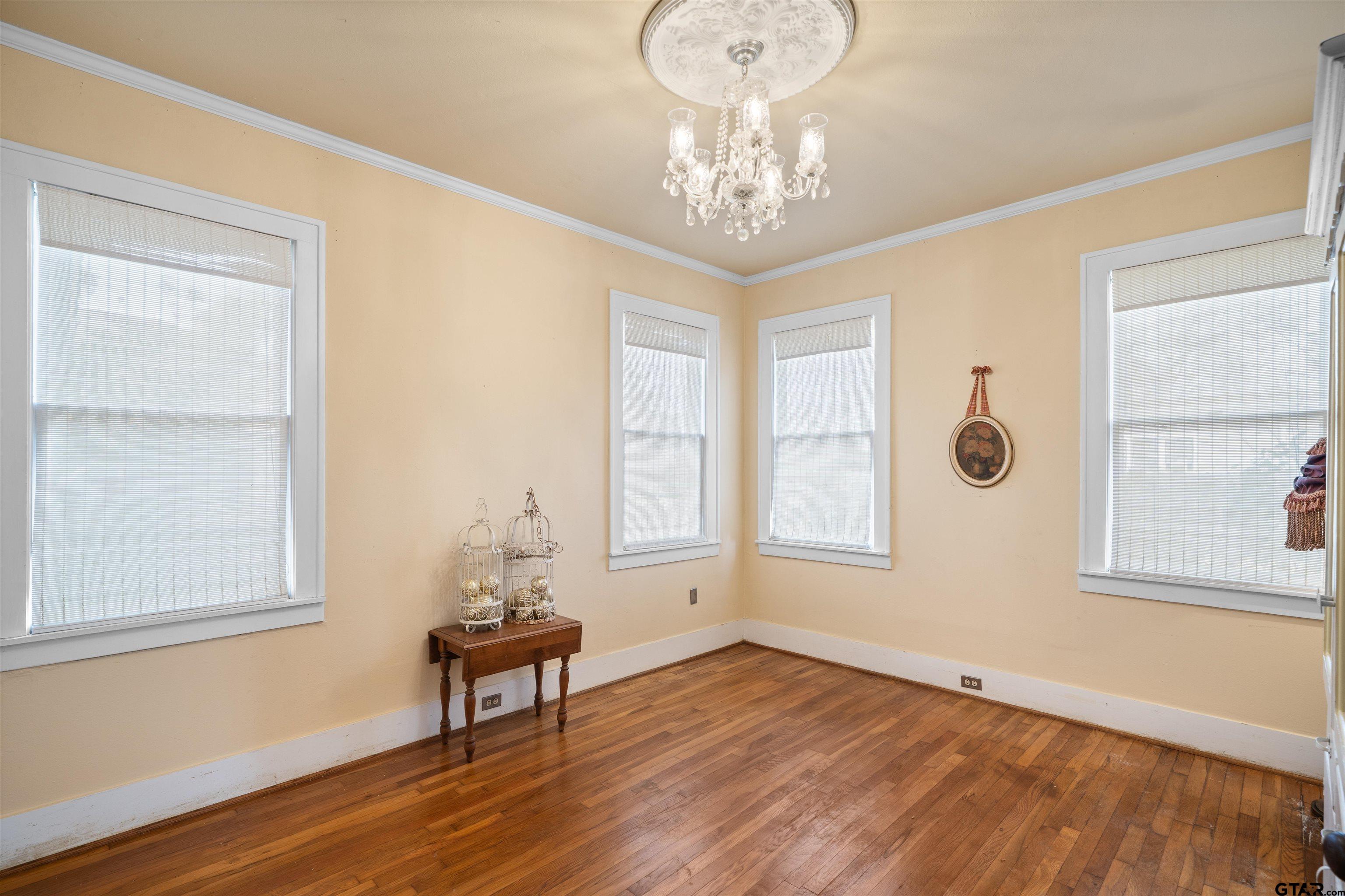 315 Mockingbird Lane Tyler, TX 75701 - Photo 19 of 33 a view of a livingroom with wooden floor and windows
