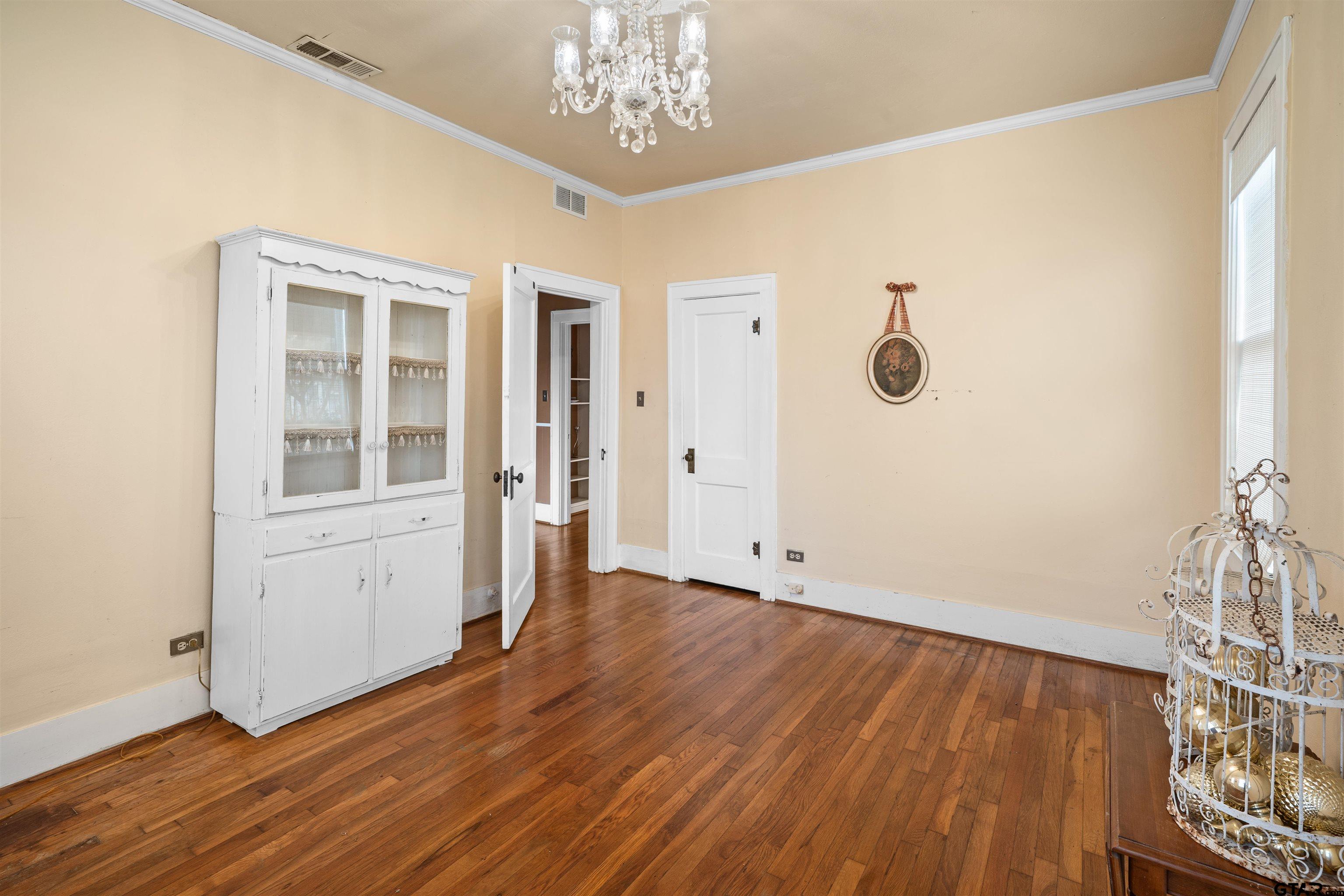 315 Mockingbird Lane Tyler, TX 75701 - Photo 20 of 33 a view of an empty room with wooden floor and a window