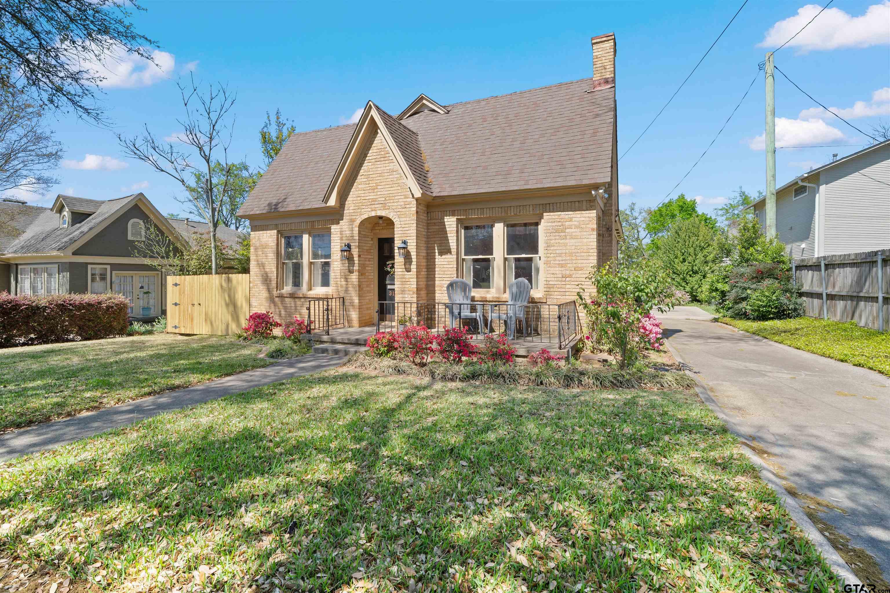 315 Mockingbird Lane Tyler, TX 75701 - Photo 2 of 33 a front view of a house with a yard and garage