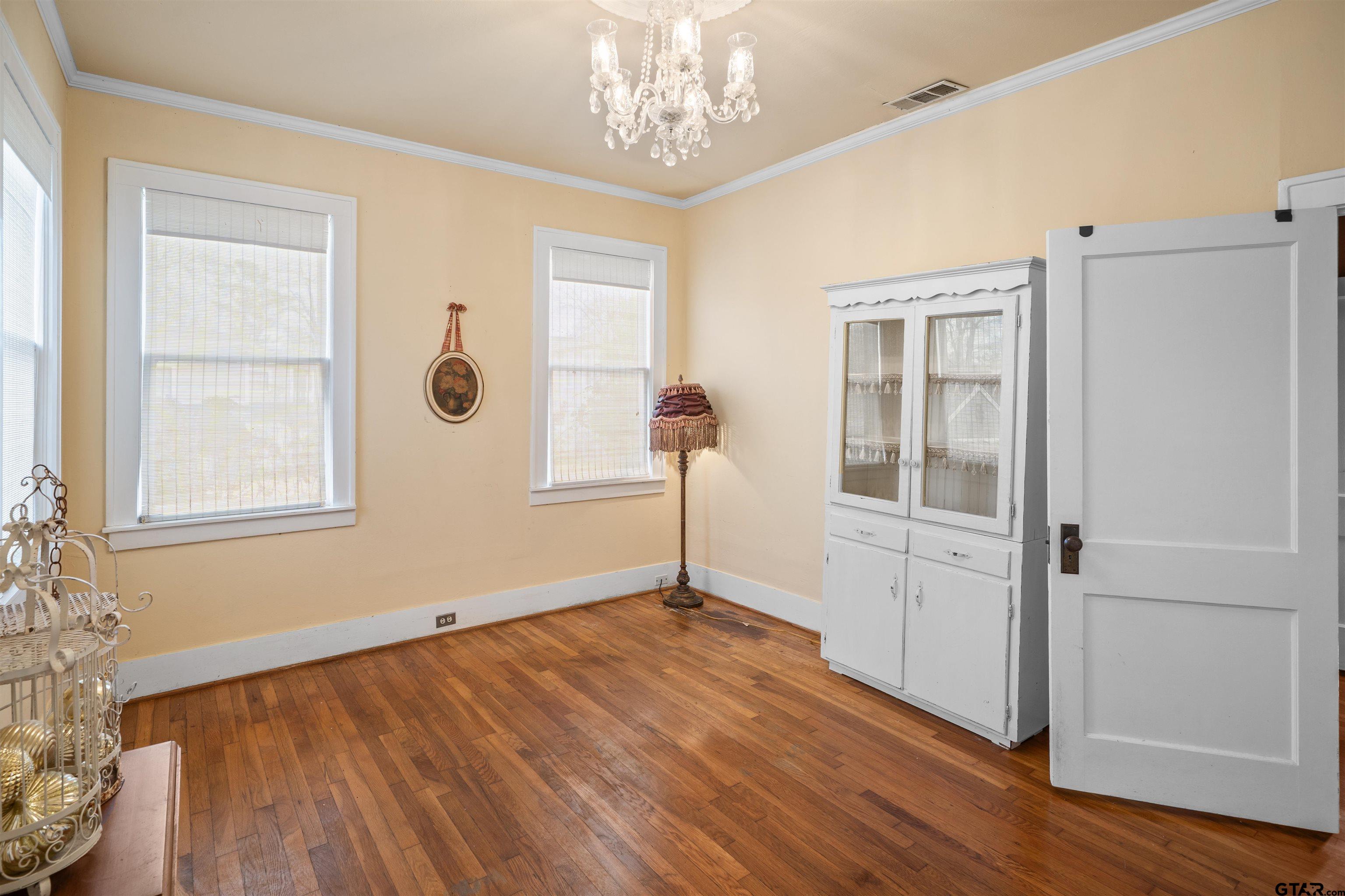 315 Mockingbird Lane Tyler, TX 75701 - Photo 21 of 33 a view of empty room with wooden floor and fan