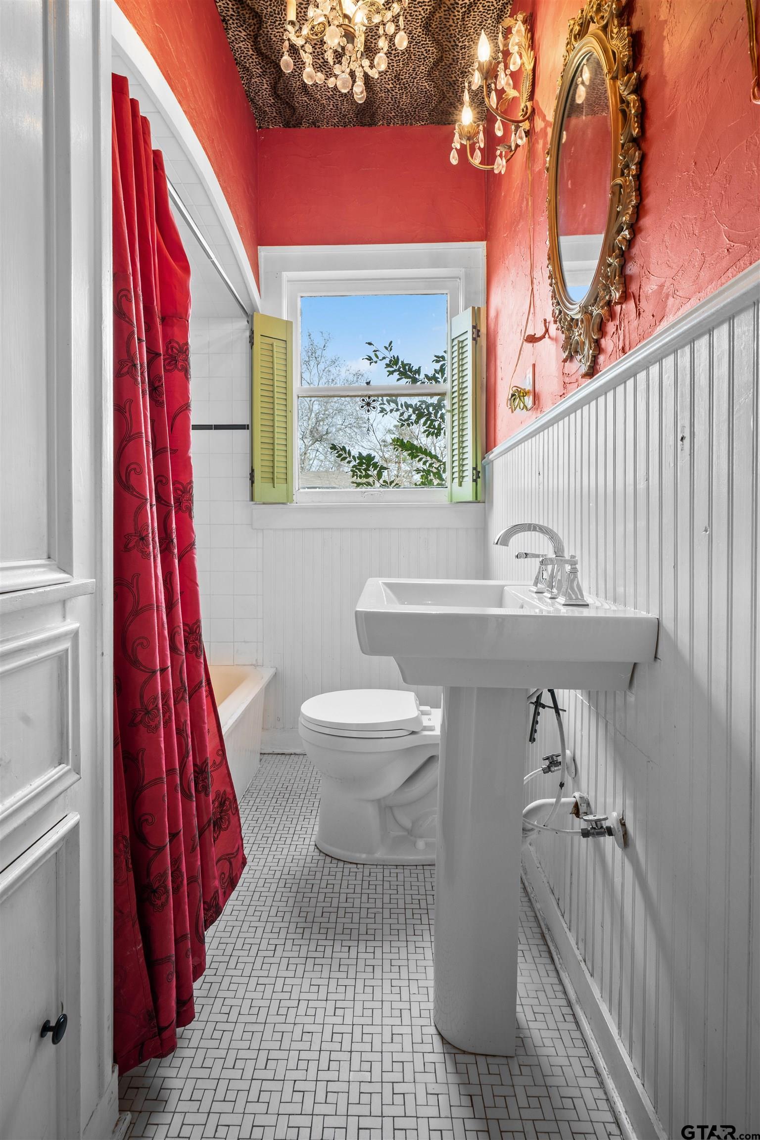 315 Mockingbird Lane Tyler, TX 75701 - Photo 25 of 33 a bathroom with a sink and a mirror