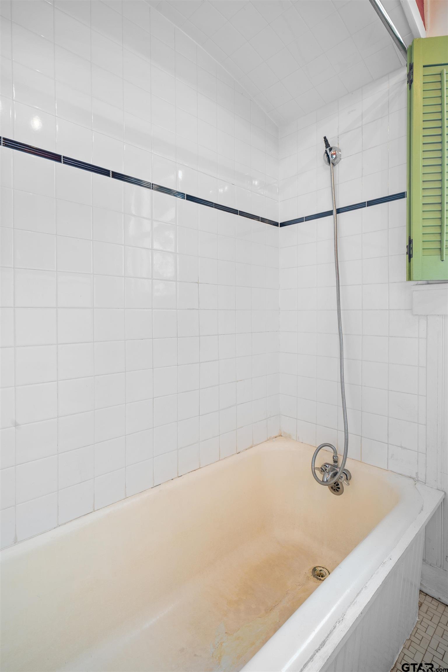 315 Mockingbird Lane Tyler, TX 75701 - Photo 26 of 33 a bathroom with a bath tub and a shower