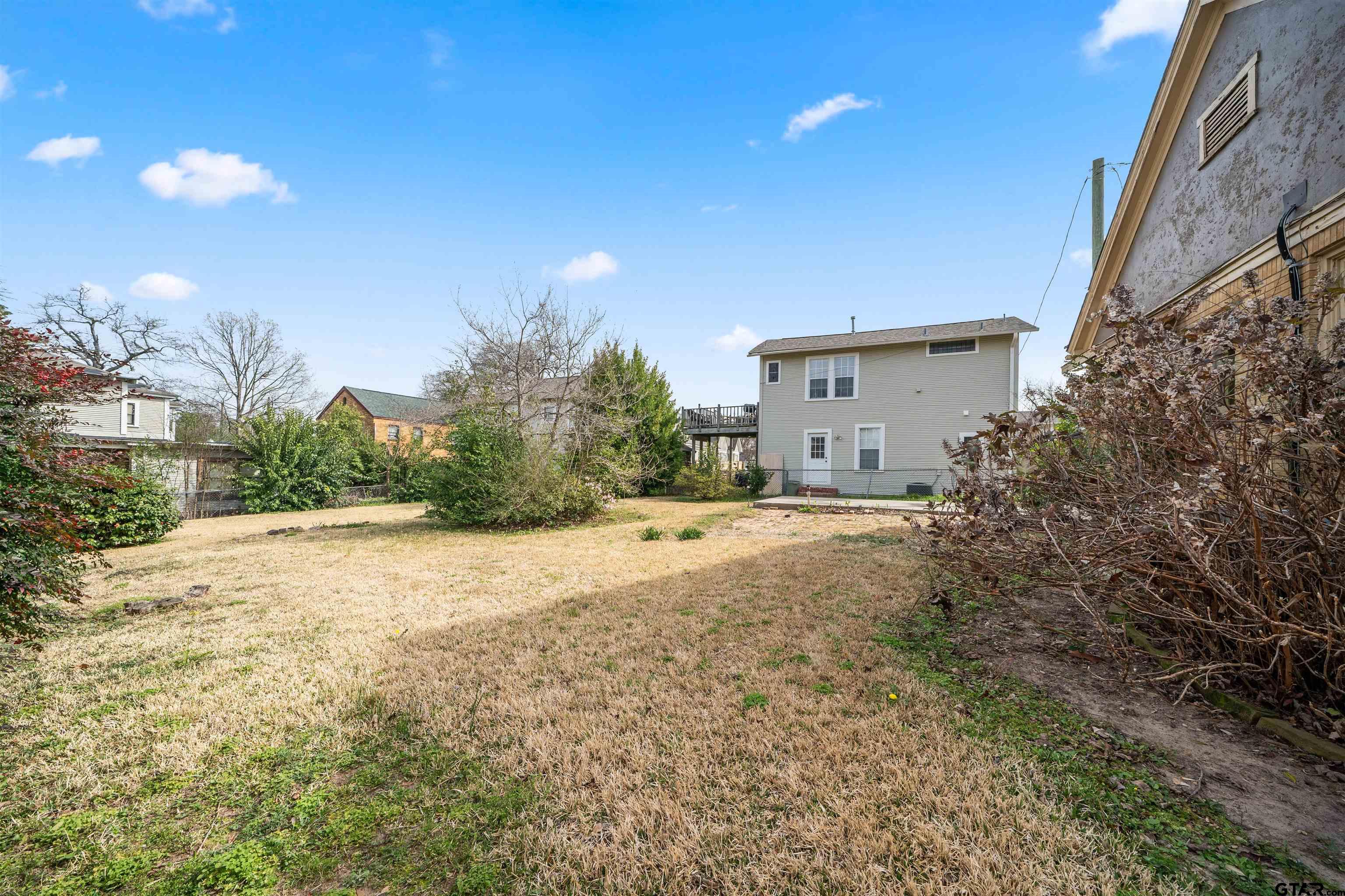 315 Mockingbird Lane Tyler, TX 75701 - Photo 27 of 33 a house with a yard