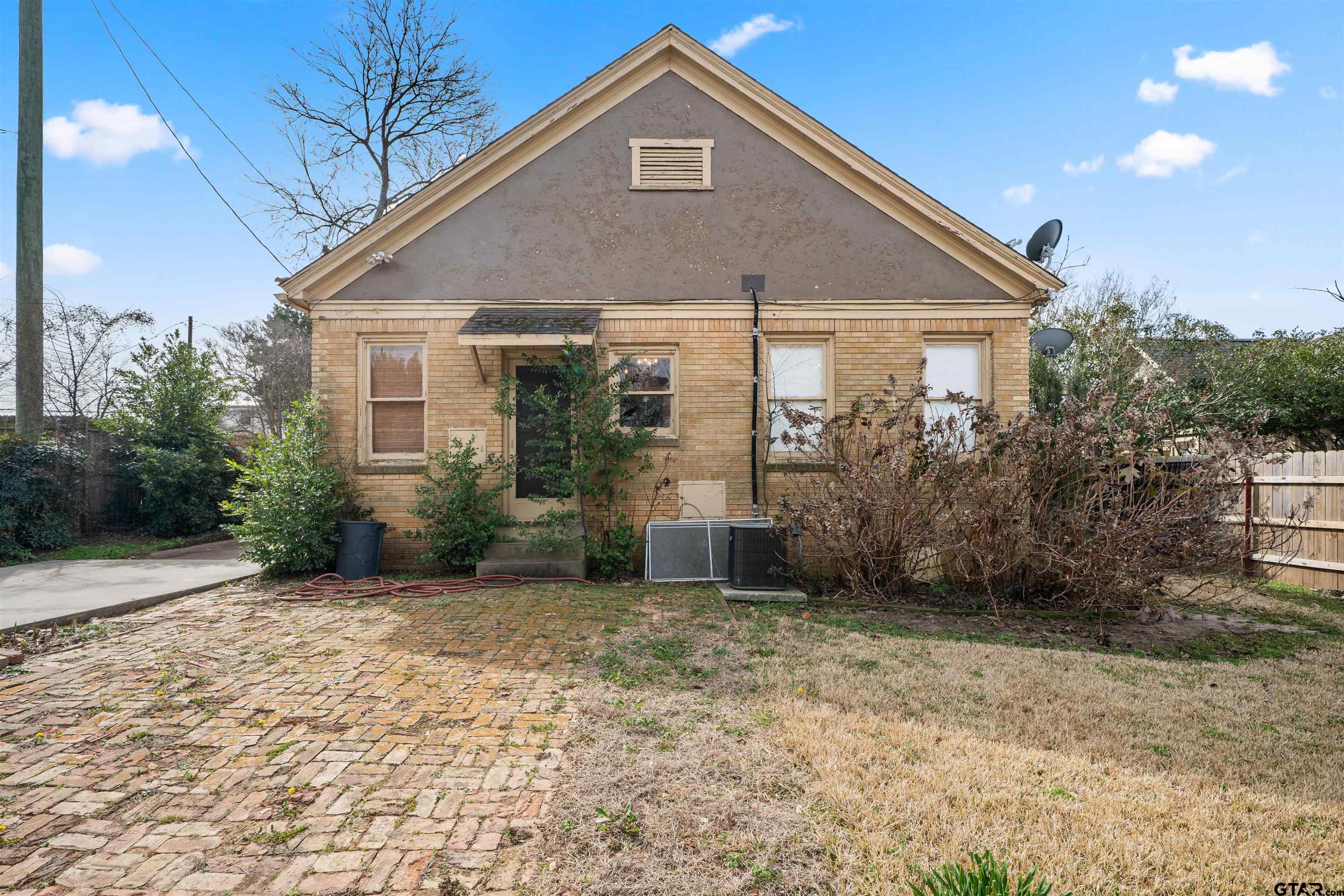 315 Mockingbird Lane Tyler, TX 75701 - Photo 29 of 33 a front view of a house with garden