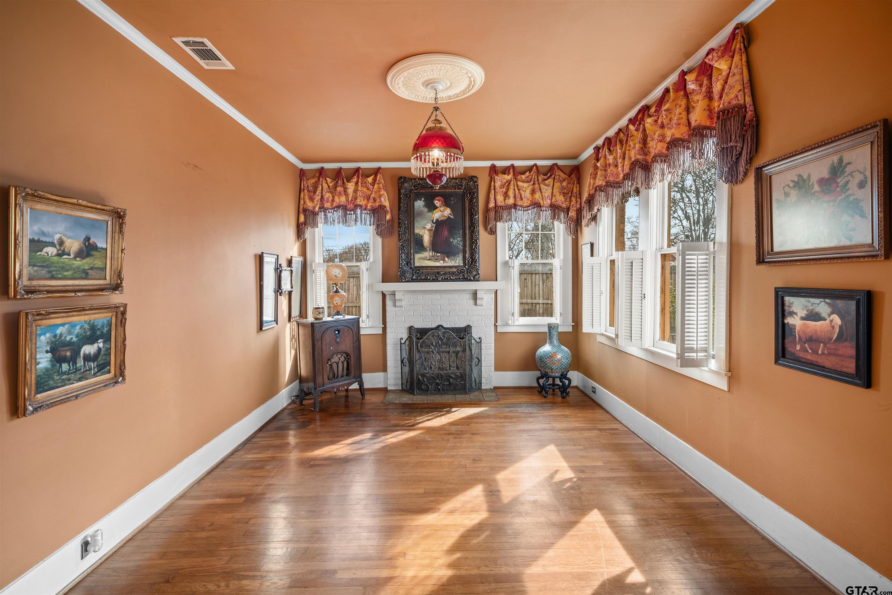 315 Mockingbird Lane Tyler, TX 75701 - Photo 5 of 33 a view of a livingroom with wooden floor and furniture