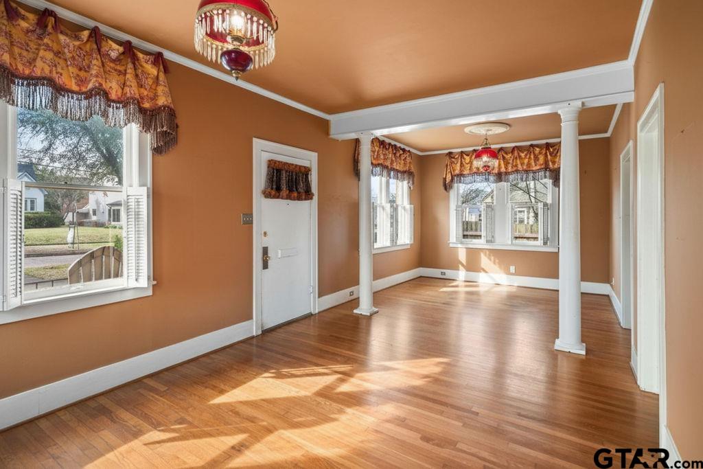 315 Mockingbird Lane Tyler, TX 75701 - Photo 6 of 33 a view of an empty room with wooden floor and a window