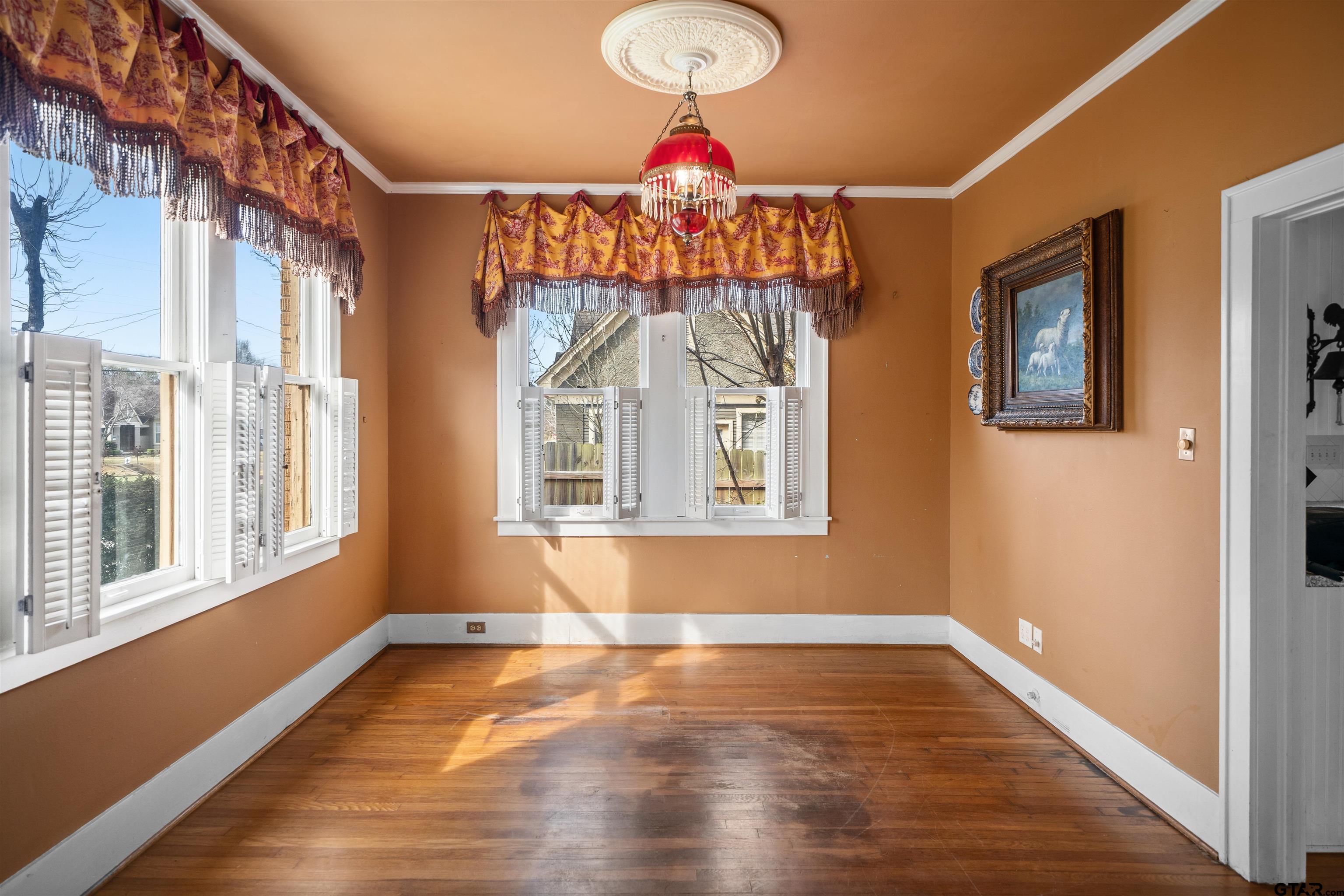 315 Mockingbird Lane Tyler, TX 75701 - Photo 8 of 33 a view of empty room with wooden floor and fan