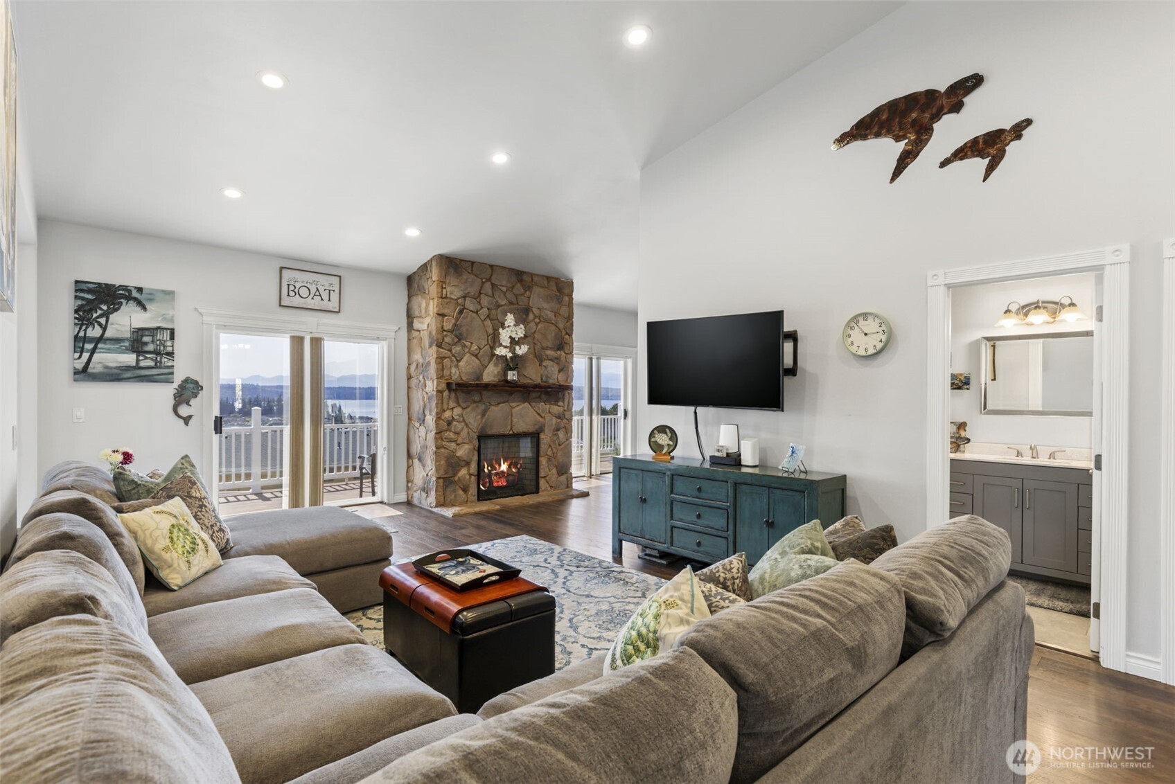 38292 Northeast Doe Road Hansville, WA 98340 - Photo 12 of 40 a living room with furniture and a flat screen tv