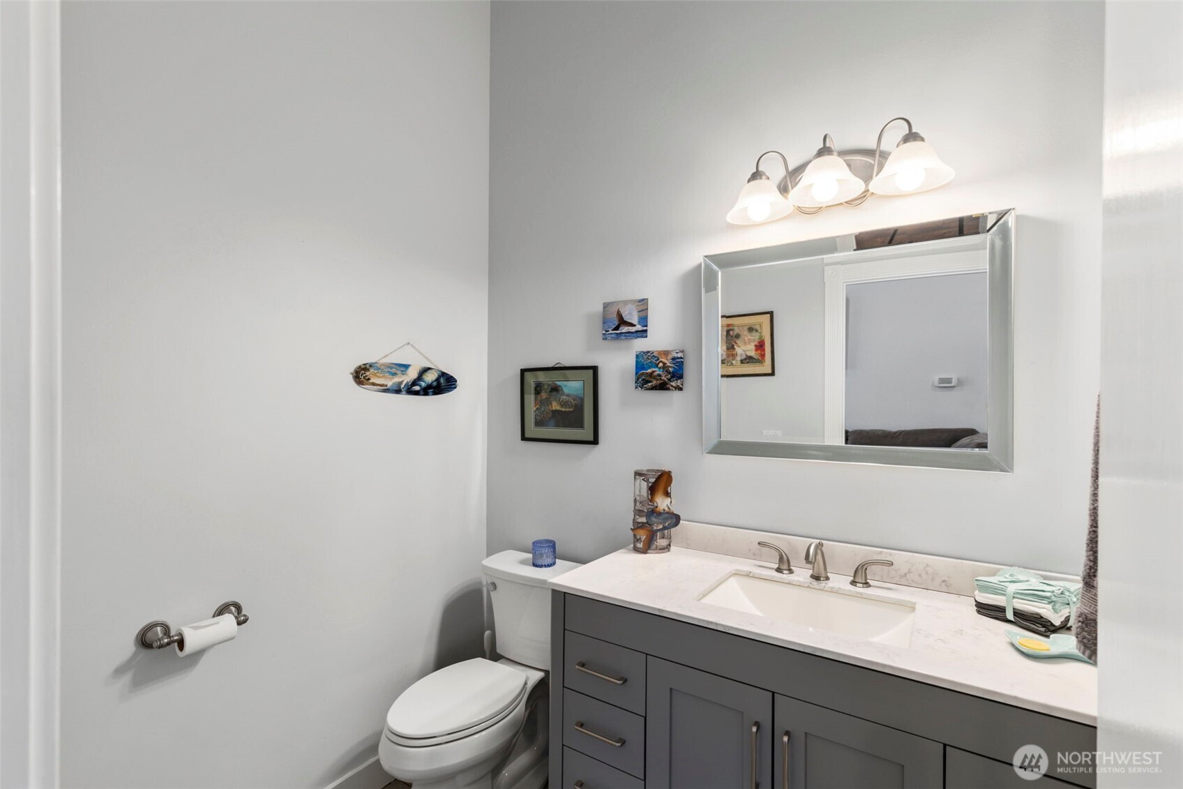38292 Northeast Doe Road Hansville, WA 98340 - Photo 16 of 40 a bathroom with a granite countertop sink mirror and toilet