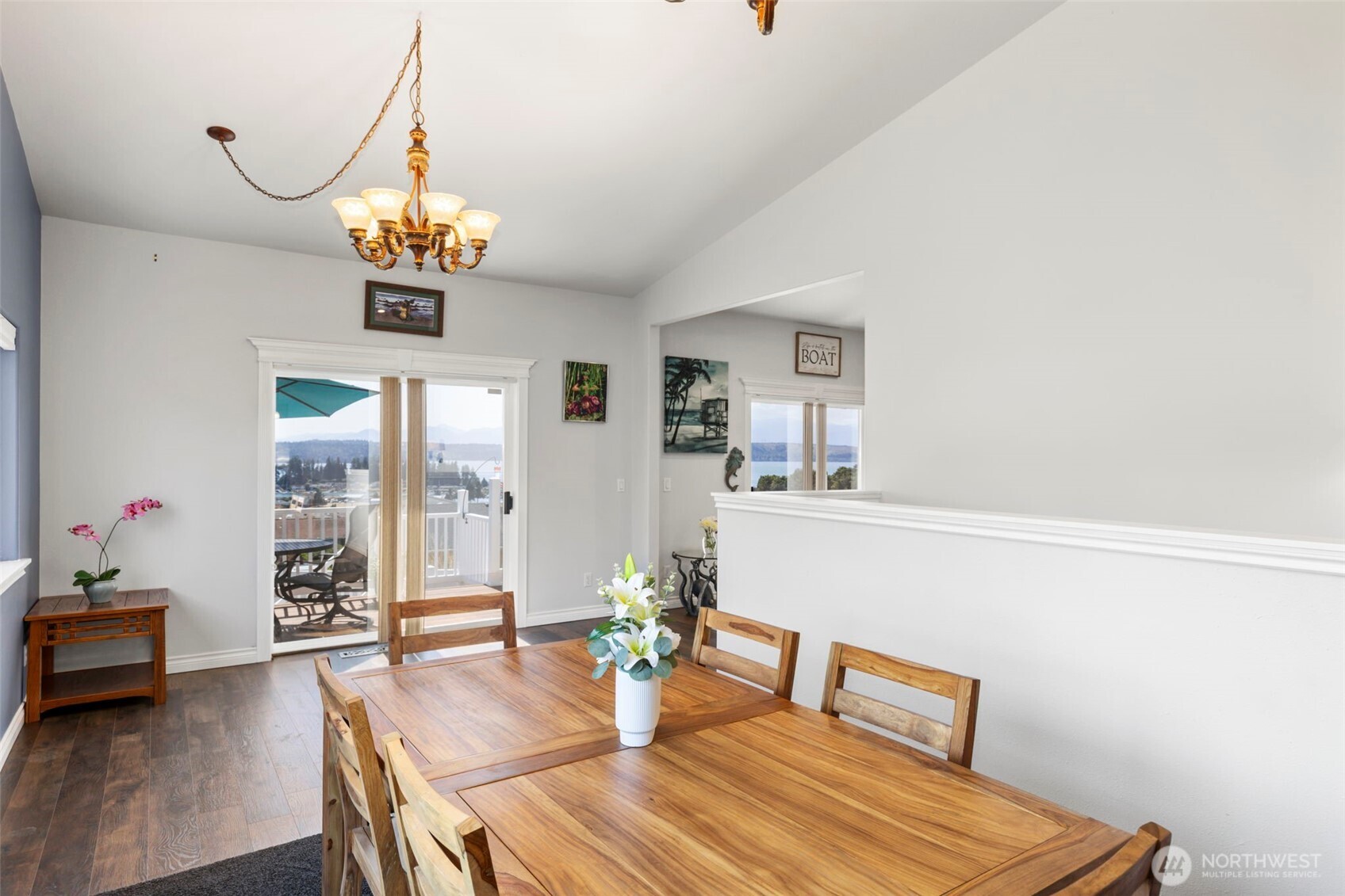 38292 Northeast Doe Road Hansville, WA 98340 - Photo 19 of 40 a view of a dining room with furniture window and wooden floor